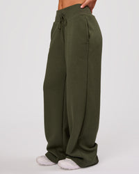 Woman wearing Go-To Wide Leg Track Pant - Pure Olive | Model:Issy | Size:XS | Thumbnail Index: 4