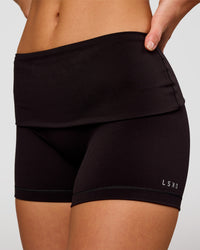 Woman wearing Groovy High Rise Fold Over 4" Short - Black | Model:Issy | Size:XS