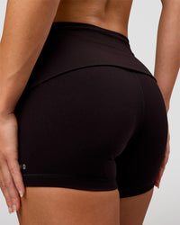 Woman wearing Groovy High Rise Fold Over 4" Short - Black | Model:Issy | Size:XS