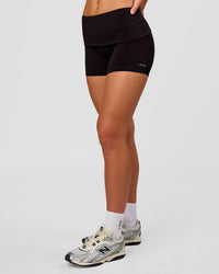 Woman wearing Groovy High Rise Fold Over 4" Short - Black | Model:Issy | Size:XS