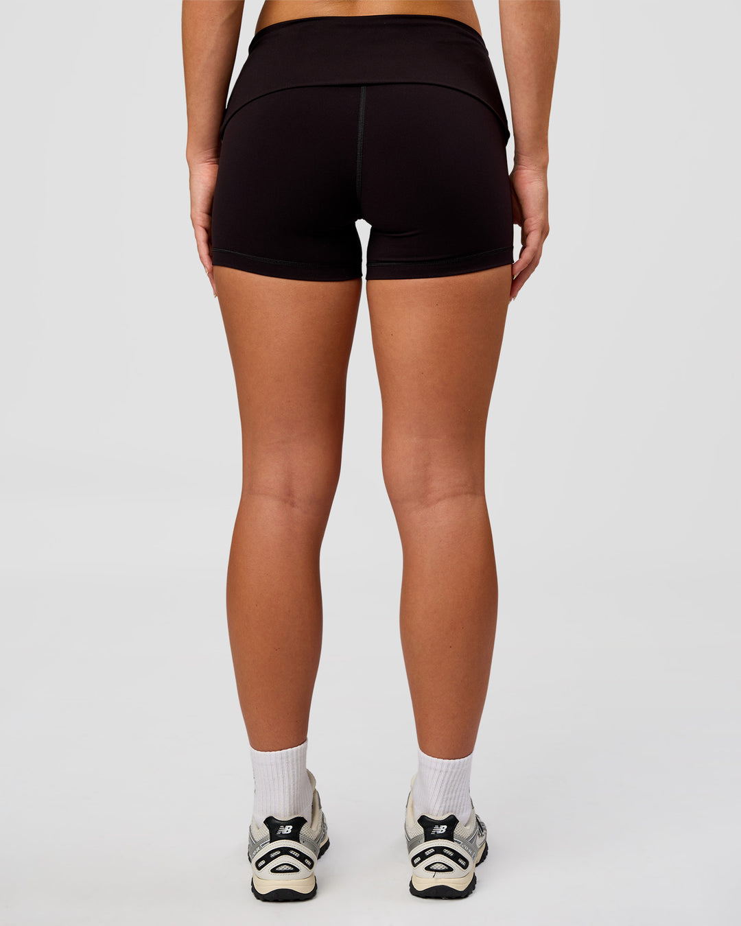 Woman wearing Groovy High Rise Fold Over 4" Short - Black | Model:Issy | Size:XS