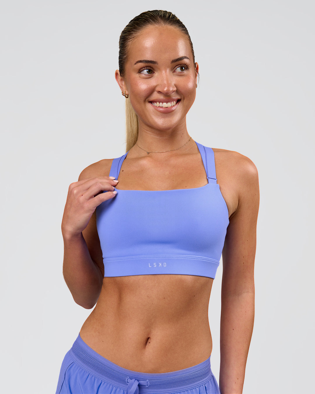 Woman wearing High Velocity Sports Bra - Bluebell | Model:Issy | Size:XS - view 1
