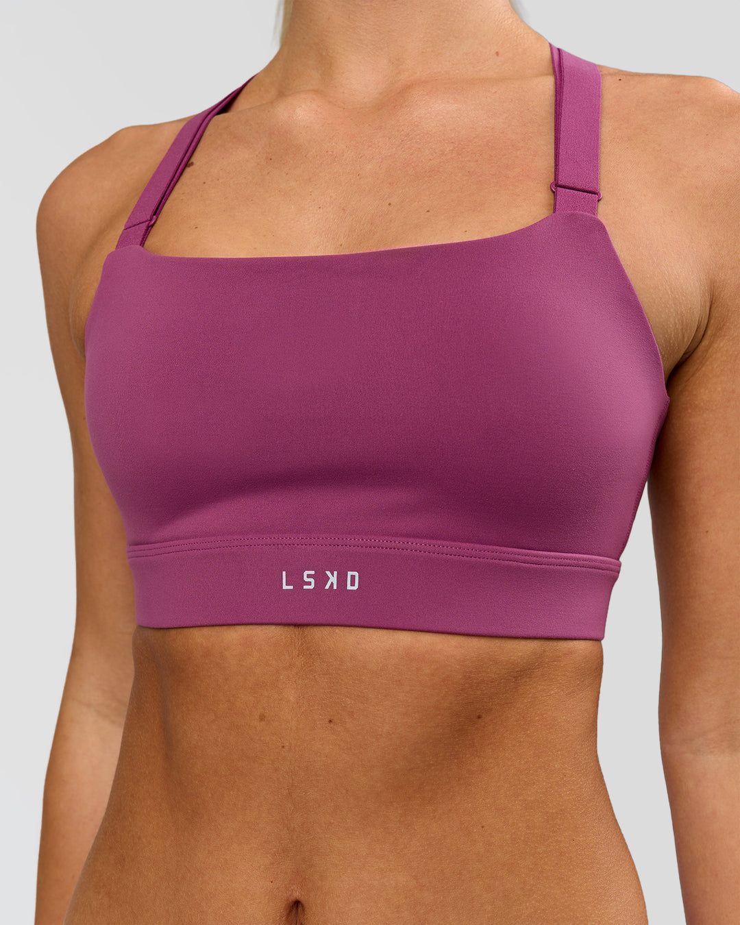 Woman wearing High Velocity Sports Bra - Boysenberry | Model:Issy | Size:XS - view 5