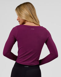 Woman wearing Horizon Long Sleeve Tee - Plum Caspia | Model:Issy | Size:XS | Thumbnail Index: 1