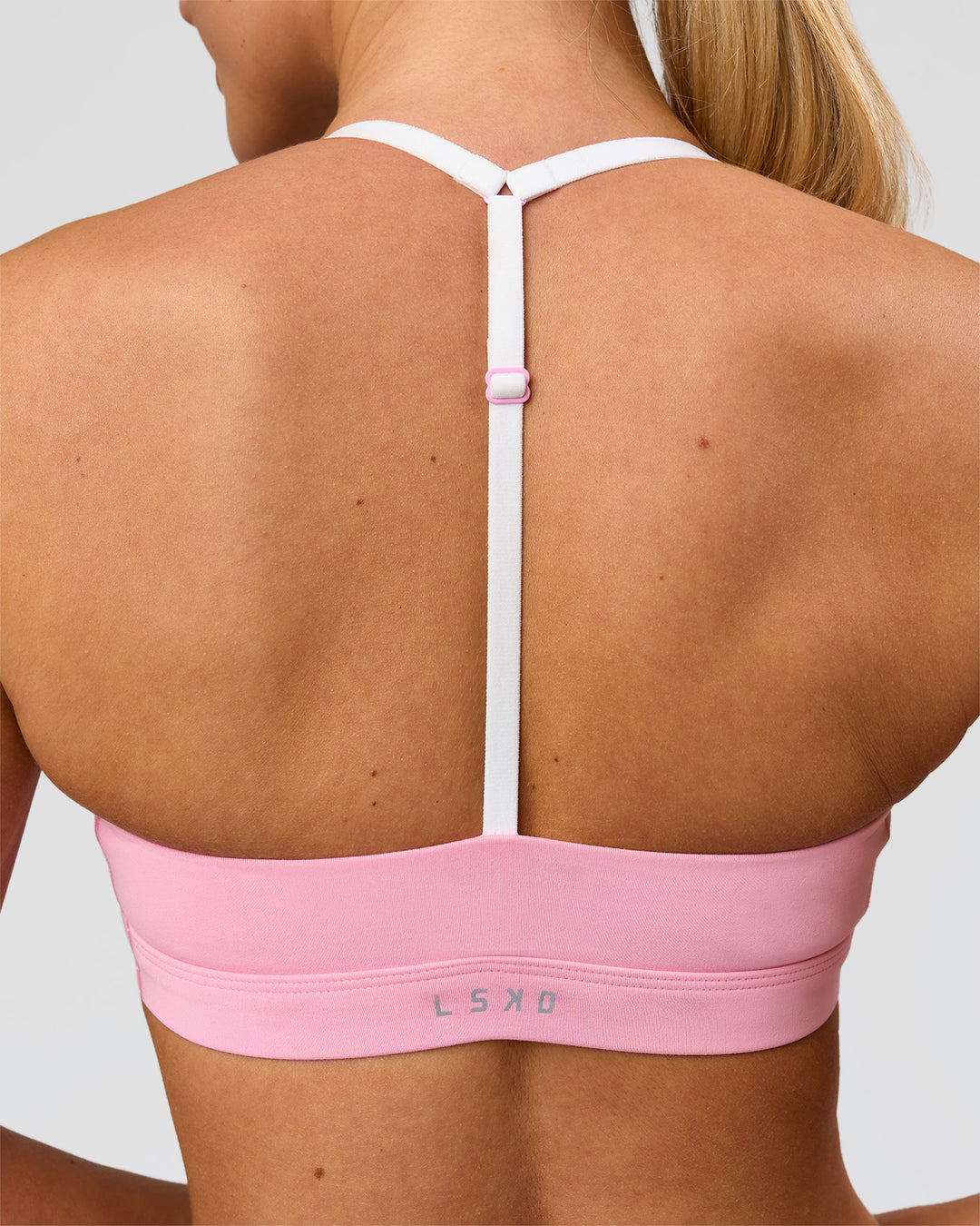 Woman wearing Infinity Sports Bra - Pink Rose | Model:Issy | Size:XS - view 3
