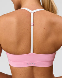 Woman wearing Infinity Sports Bra - Pink Rose | Model:Issy | Size:XS | Thumbnail Index: 2