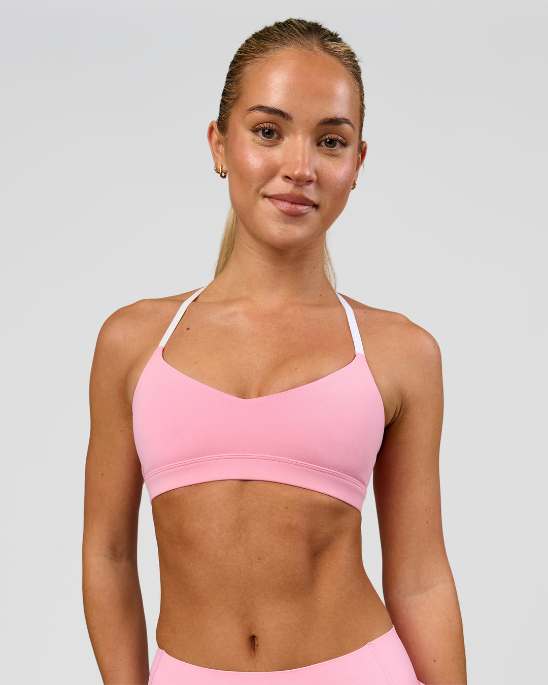 Woman wearing Infinity Sports Bra - Pink Rose | Model:Issy | Size:XS - view 5