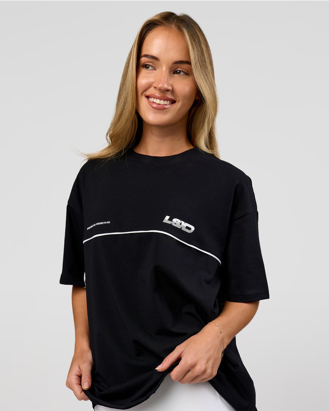 Woman wearing Inline Heavyweight FLXCotton Oversized Tee - Black-White | Model:Issy | Size:XS - view 6