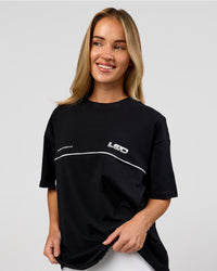 Woman wearing Inline Heavyweight FLXCotton Oversized Tee - Black-White | Model:Issy | Size:XS | Thumbnail Index: 5