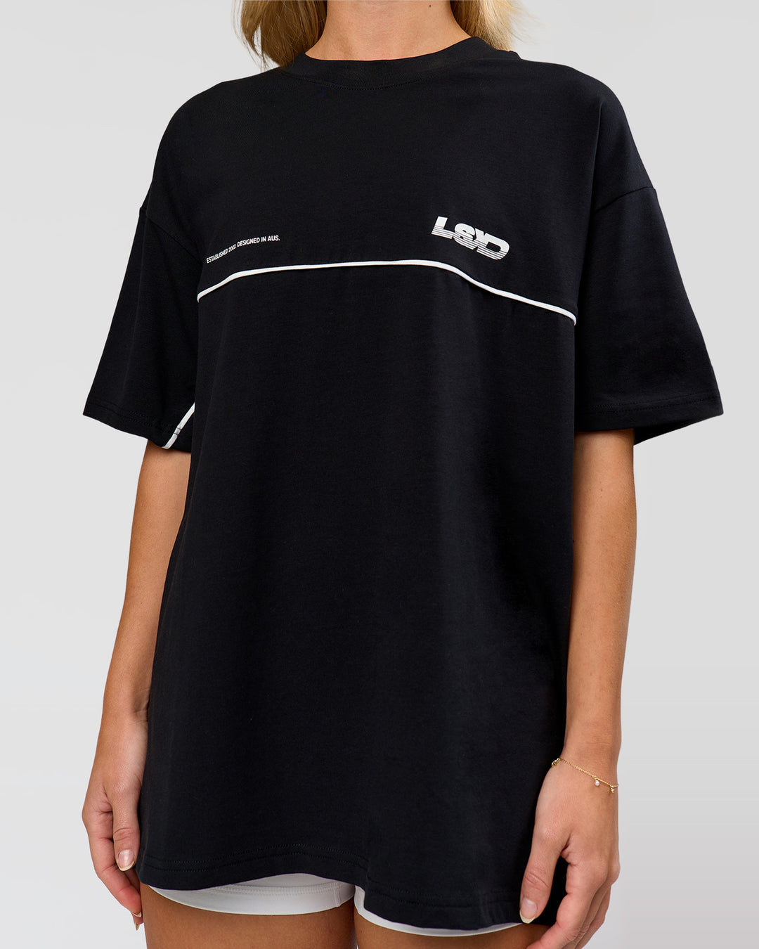 Woman wearing Inline Heavyweight FLXCotton Oversized Tee - Black-White | Model:Issy | Size:XS - view 9