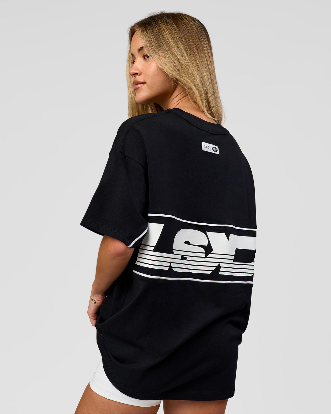 Woman wearing Inline Heavyweight FLXCotton Oversized Tee - Black-White | Model:Issy | Size:XS - view 17
