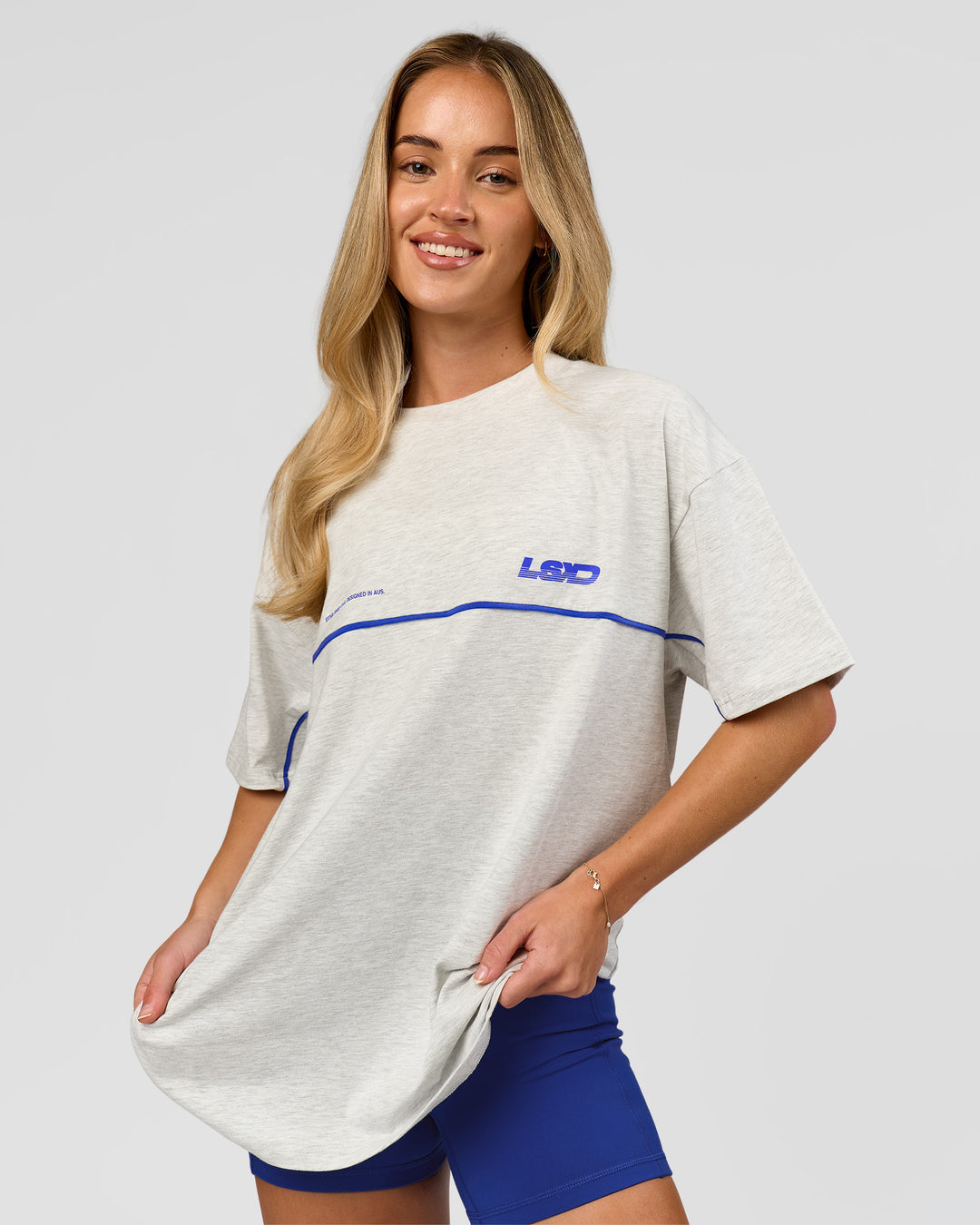 Woman wearing Inline Heavyweight FLXCotton Oversized Tee - Silver Marl-Power Cobalt | Model:Issy | Size:XS - view 9