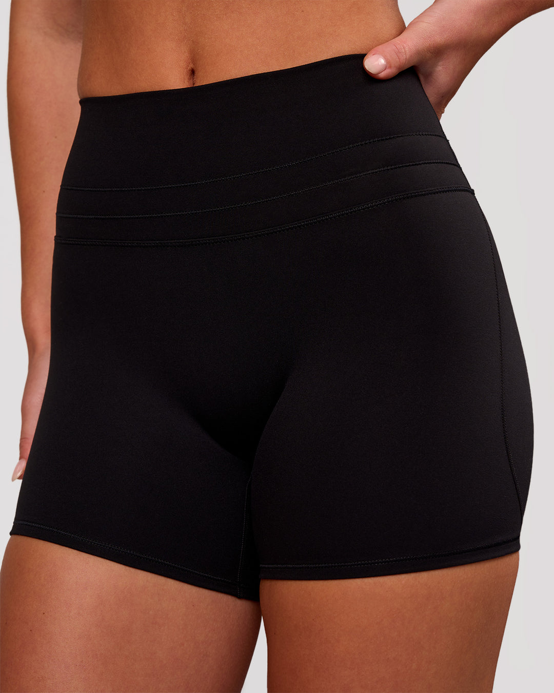 Woman wearing Luxe V-Contour High-Rise 4" Short - Black | Model:Issy | Size:XS - view 2