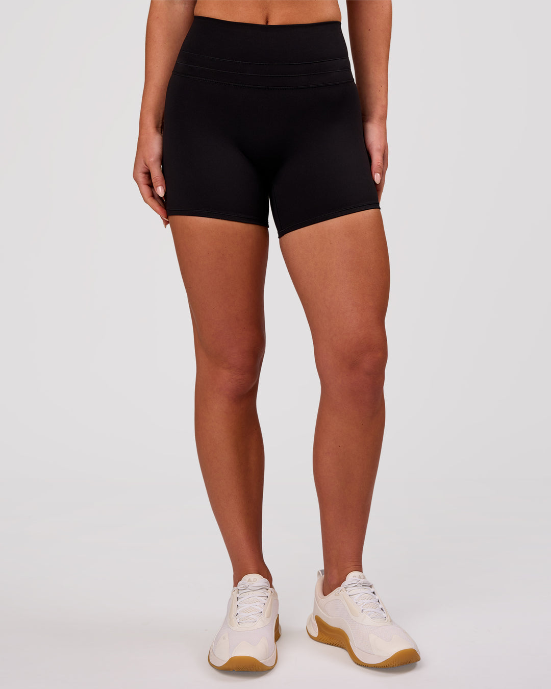 Woman wearing Luxe V-Contour High-Rise 4" Short - Black | Model:Issy | Size:XS - view 4