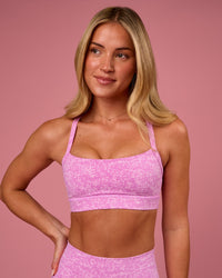 Woman wearing Momentum Sports Bra - Energy Print Marshmallow | Model:Issy | Size:XS | Thumbnail Index: 0