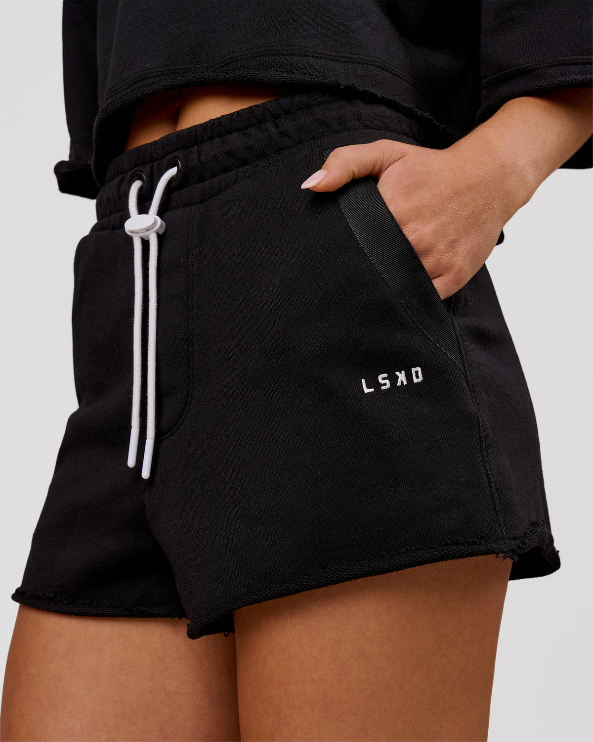 Woman wearing MVP Elite Terry Short - Black-White | Model:Issy | Size:XS