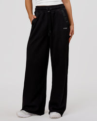 Woman wearing MVP Elite Terry Wide Leg Pant - Black-White | Model:Issy | Size:XS | Thumbnail Index: 0