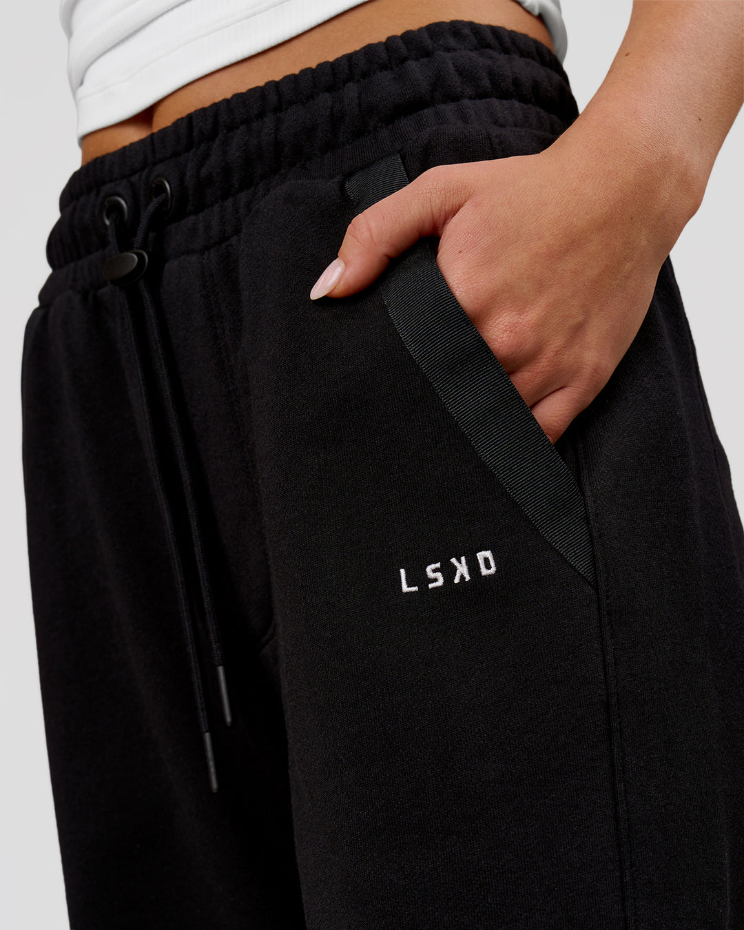 Woman wearing MVP Elite Terry Wide Leg Pant - Black-White | Model:Issy | Size:XS - view 3