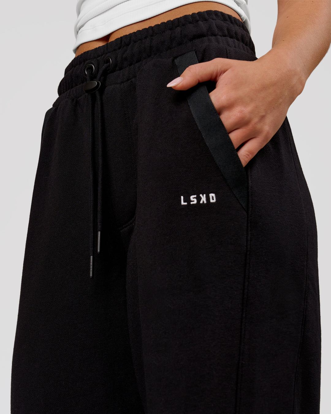 Woman wearing MVP Elite Terry Wide Leg Pant - Black-White | Model:Issy | Size:XS - view 9