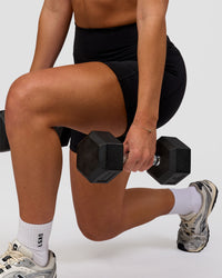 Woman wearing O.G. Fusion Ultra High-Rise 6" Short Pockets - Black | Model:Issy | Size:XS | Thumbnail Index: 6