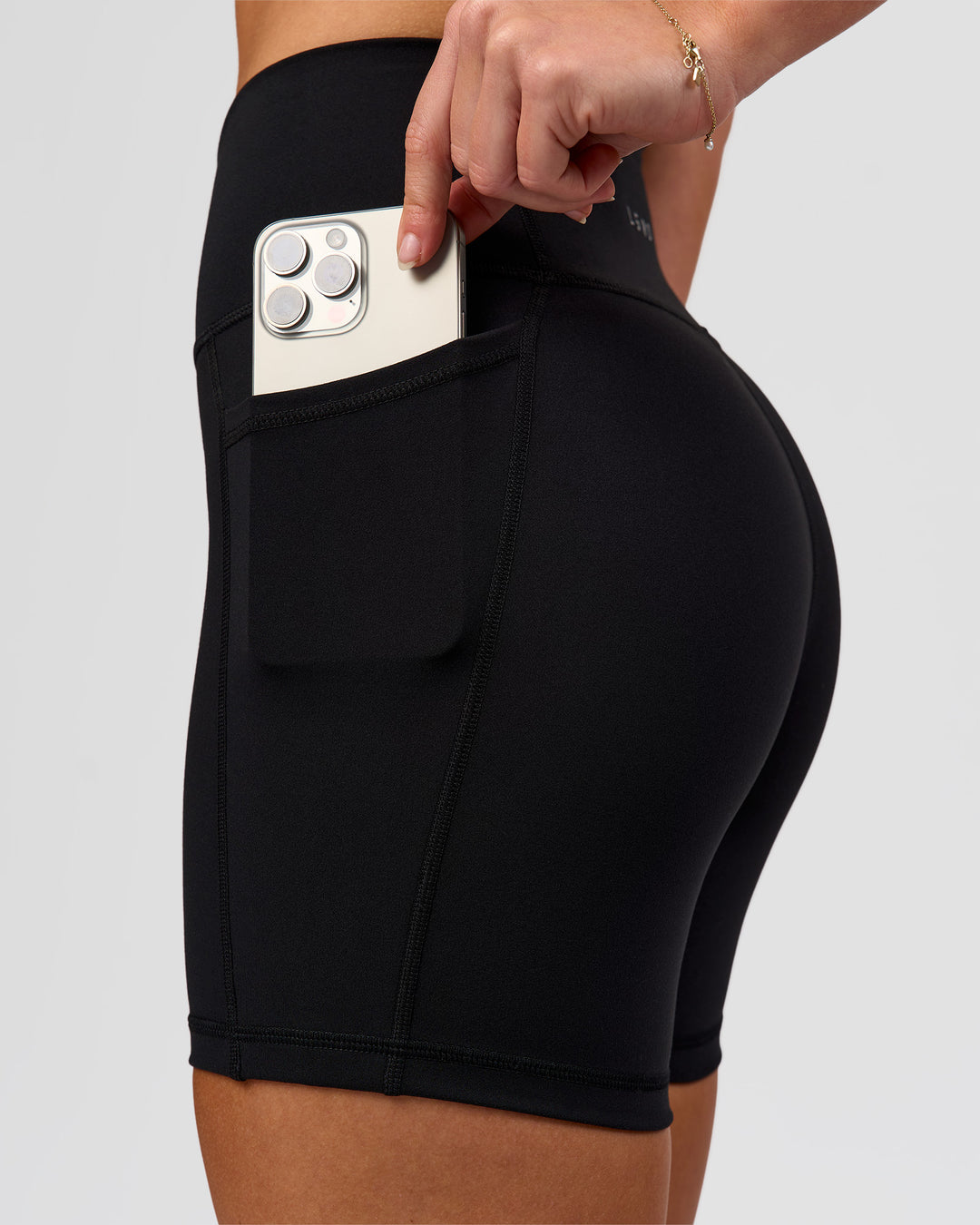 Woman wearing O.G. Fusion Ultra High-Rise 6" Short Pockets - Black | Model:Issy | Size:XS - view 10