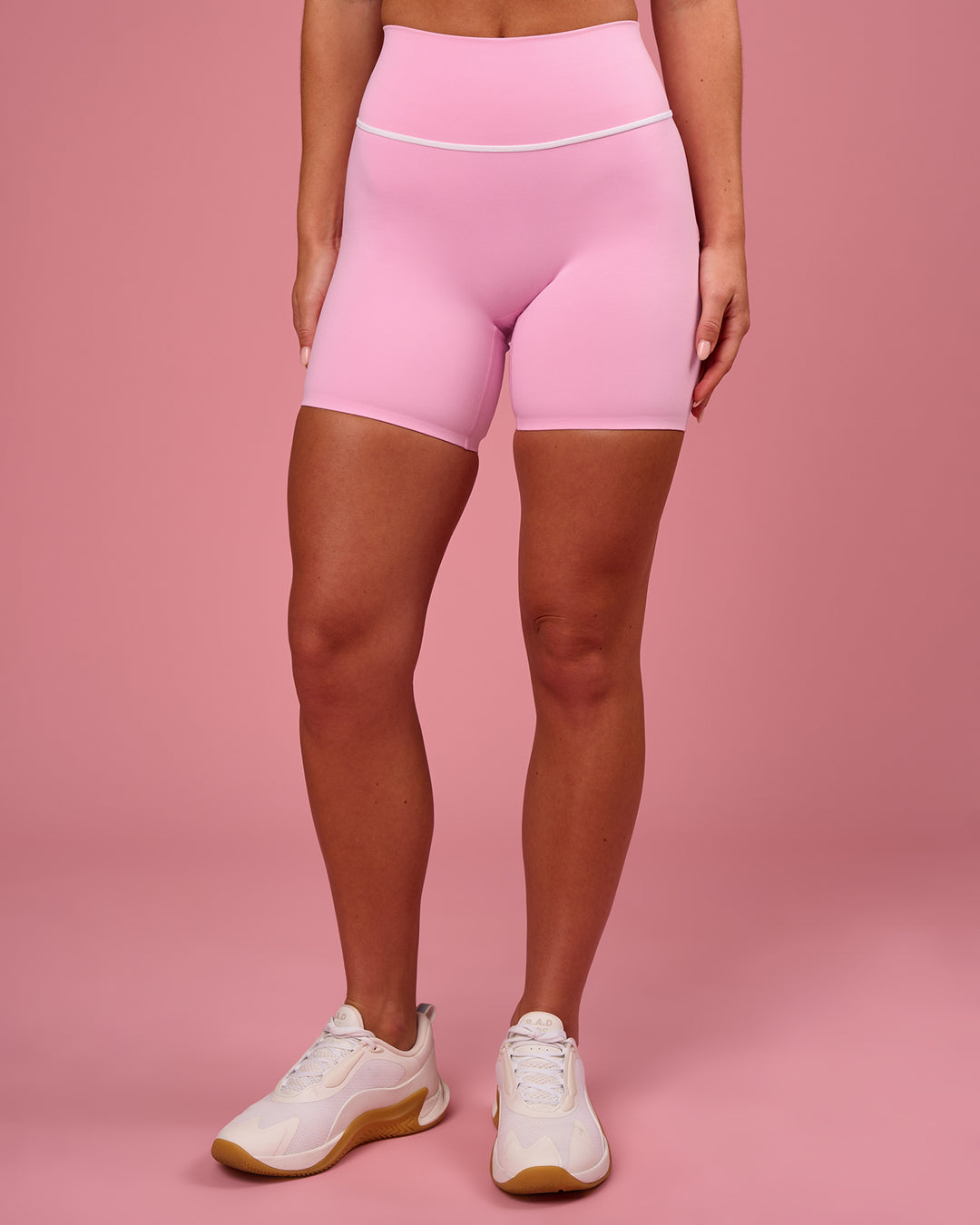 Woman wearing Pinnacle High-Rise 6" Short - Pink Rose-White | Model:Issy | Size:XS - view 6
