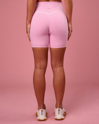 Woman wearing Pinnacle High-Rise 6" Short - Pink Rose-White | Model:Issy | Size:XS | Thumbnail Index: 4