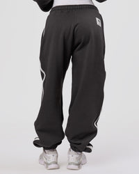 Woman wearing Playbook Baggy Cuffed Track Pant - Onyx-Off White | Model:Issy | Size:XS | Thumbnail Index: 5