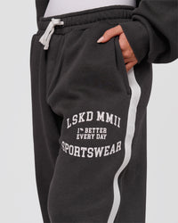 Woman wearing Playbook Baggy Cuffed Track Pant - Onyx-Off White | Model:Issy | Size:XS | Thumbnail Index: 8
