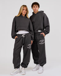 Woman wearing Playbook Baggy Cuffed Track Pant - Onyx-Off White | Model:Issy | Size:XS | Thumbnail Index: 9