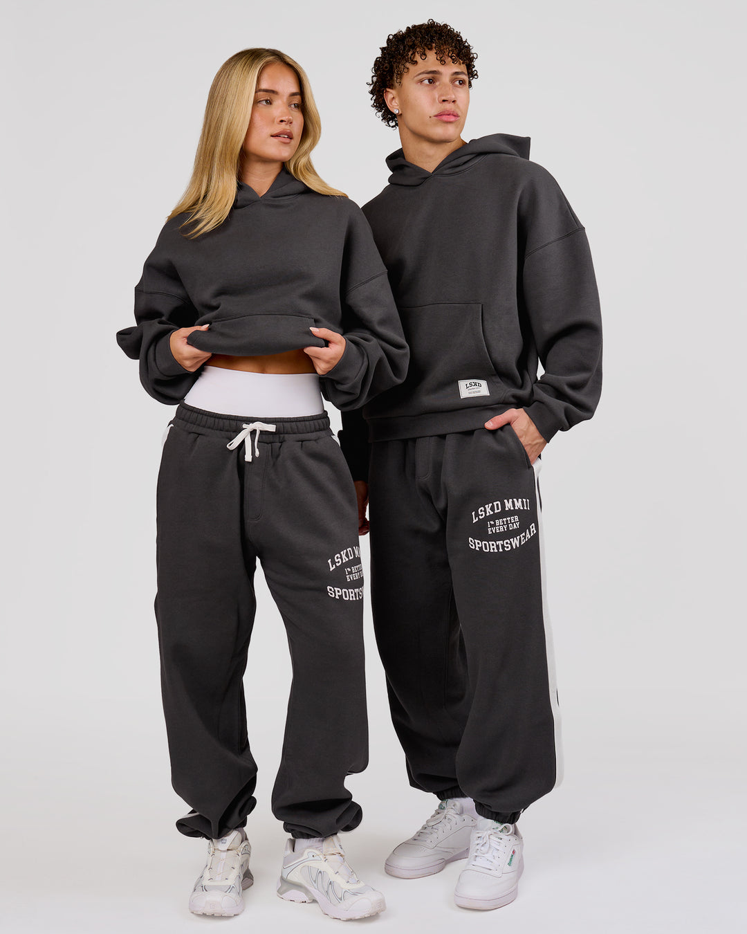 Woman wearing Playbook Baggy Cuffed Track Pant - Onyx-Off White | Model:Issy | Size:XS - view 12