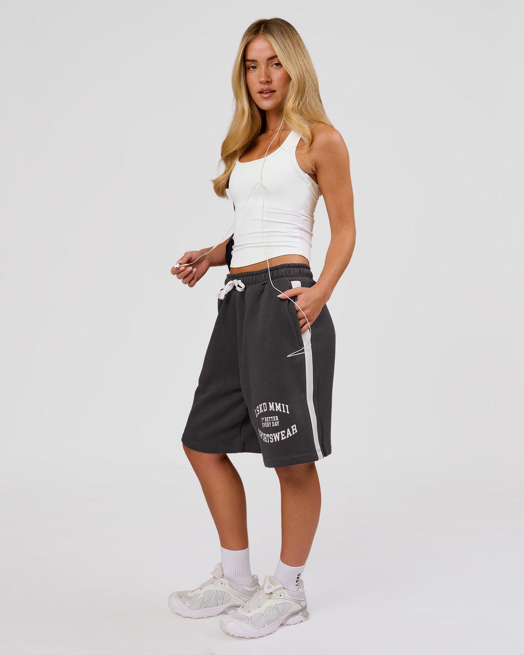 Woman wearing Playbook Varsity Fleece Shorts - Onyx-Off White | Model:Issy | Size:XS - view 6
