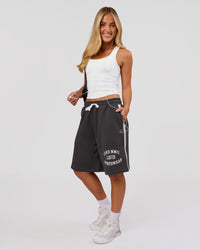 Woman wearing Playbook Varsity Fleece Shorts - Onyx-Off White | Model:Issy | Size:XS | Thumbnail Index: 7