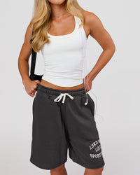 Woman wearing Playbook Varsity Fleece Shorts - Onyx-Off White | Model:Issy | Size:XS | Thumbnail Index: 9