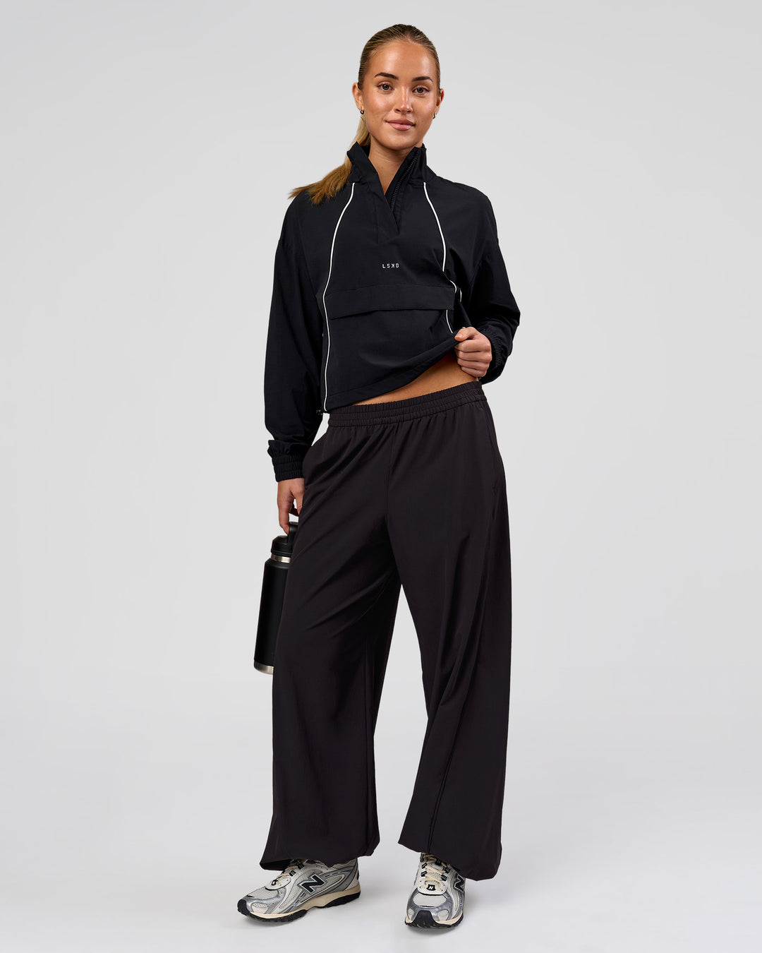 Woman wearing Pop Over Jacket - Black | Model:Issy | Size:XS - view 4