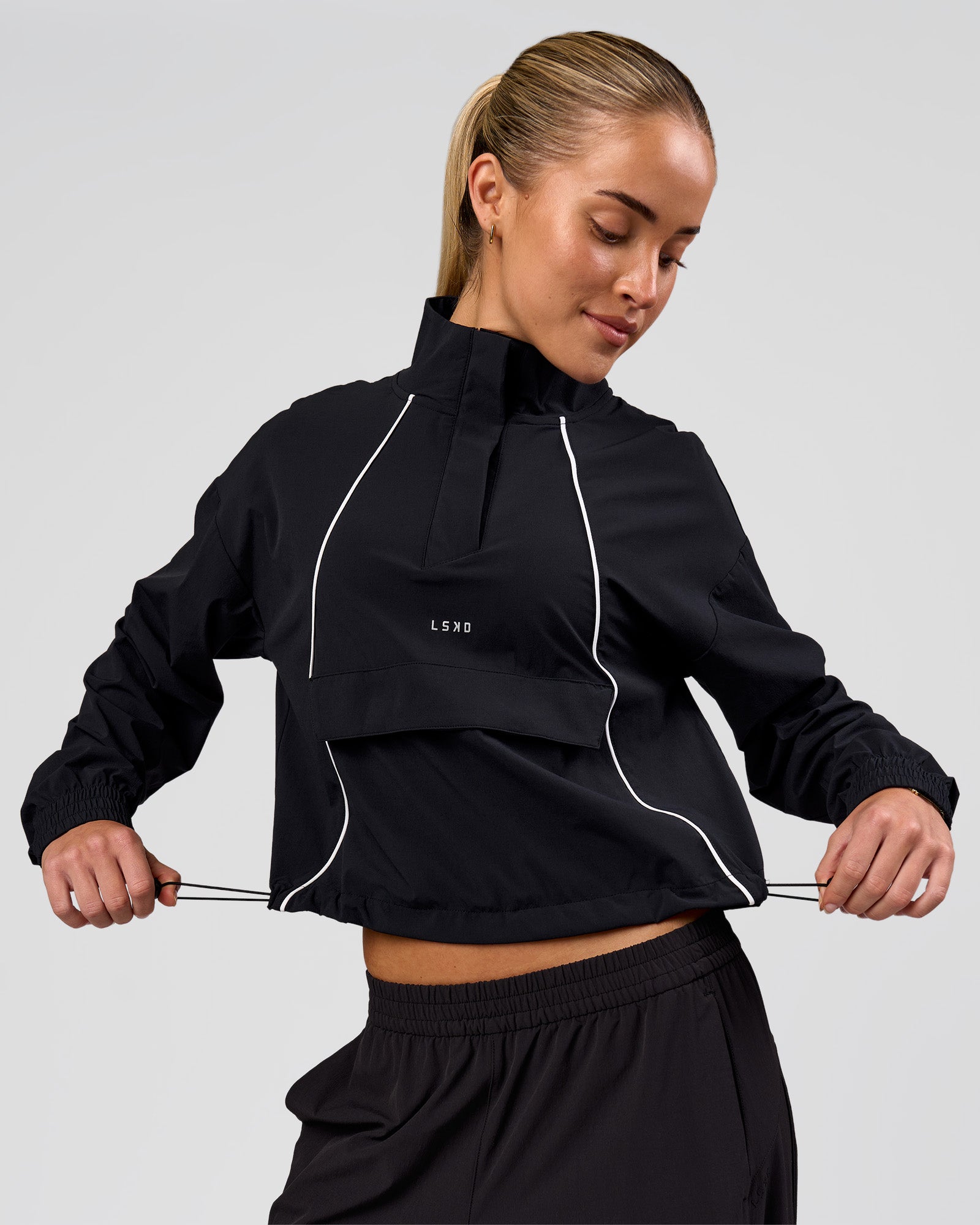 Woman wearing Pop Over Jacket - Black | Model:Issy | Size:XS