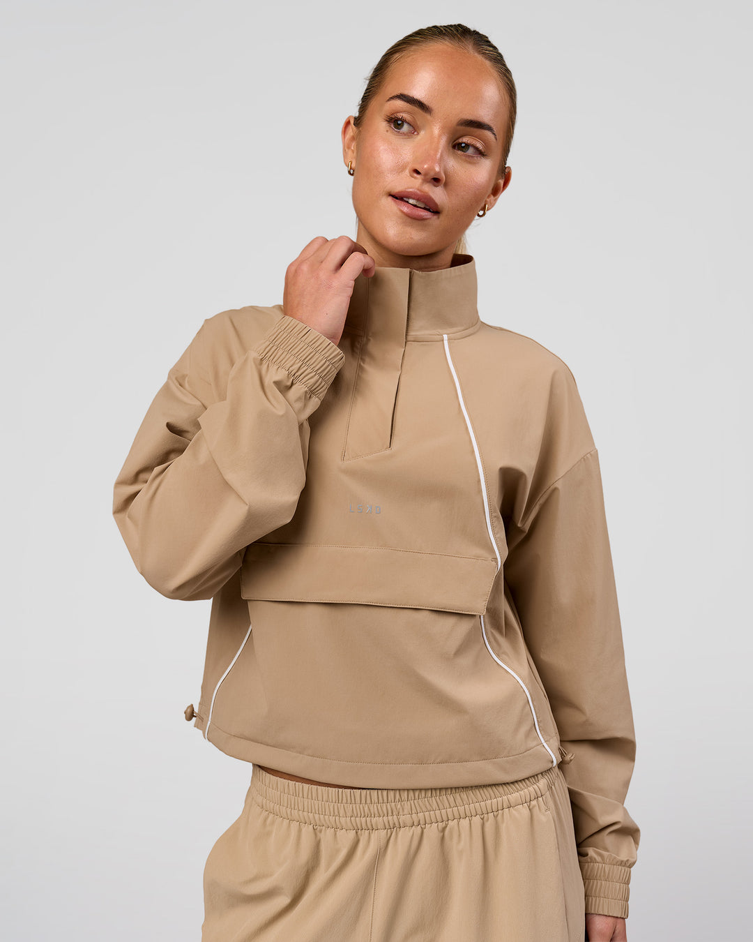 Woman wearing Pop Over Jacket - Warm Smoke | Model:Issy | Size:XS - view 1