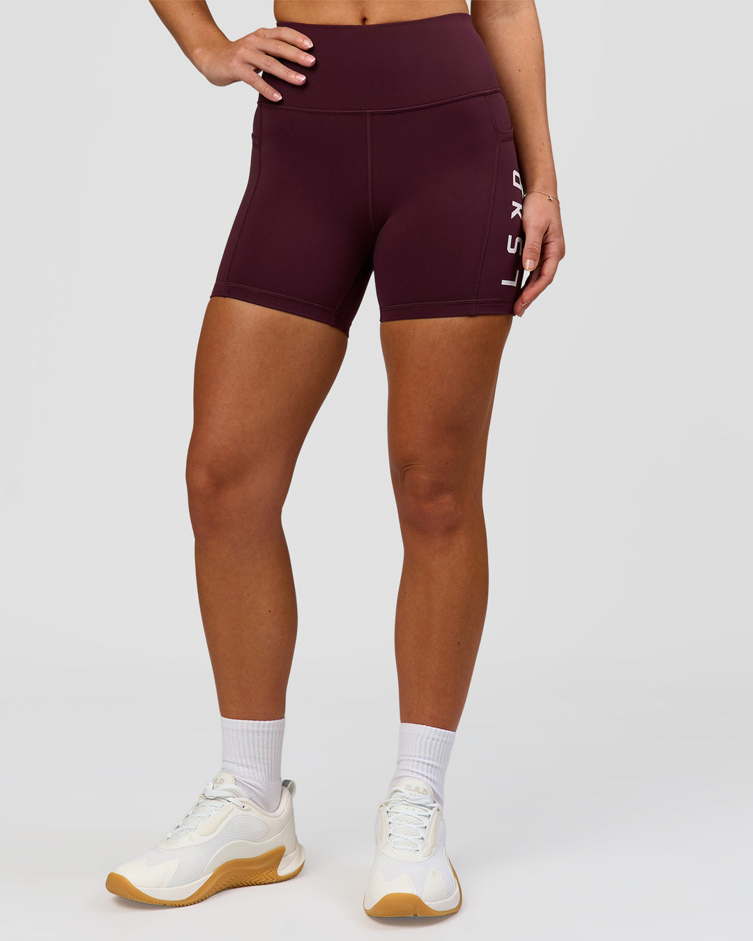 Woman wearing Rep Ultra High-Rise 4" Short Pockets - Cherry Lacquer-White | Model:Issy | Size:XS - view 2