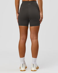 Woman wearing Rep Ultra High-Rise 4" Short Pockets - Onyx-White | Model:Issy | Size:XS | Thumbnail Index: 4
