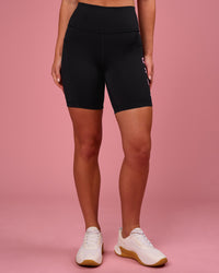 Woman wearing Rep Ultra High-Rise 6" Short Pockets - Black-Pink Rose | Model:Issy | Size:XS | Thumbnail Index: 6