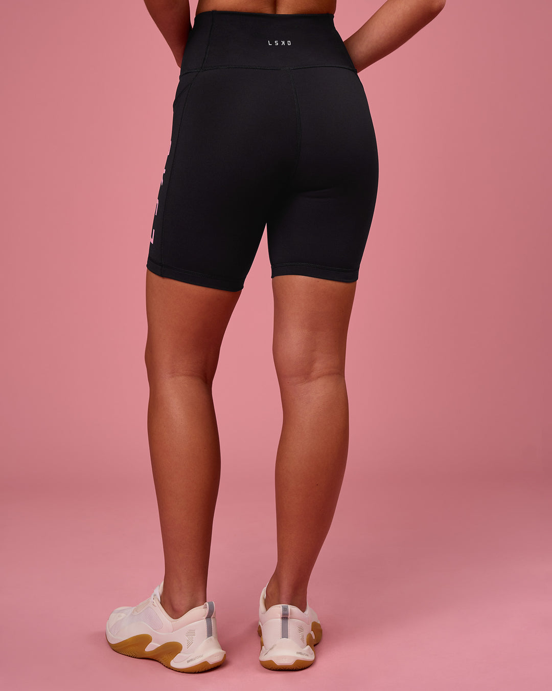 Woman wearing Rep Ultra High-Rise 6" Short Pockets - Black-Pink Rose | Model:Issy | Size:XS - view 3