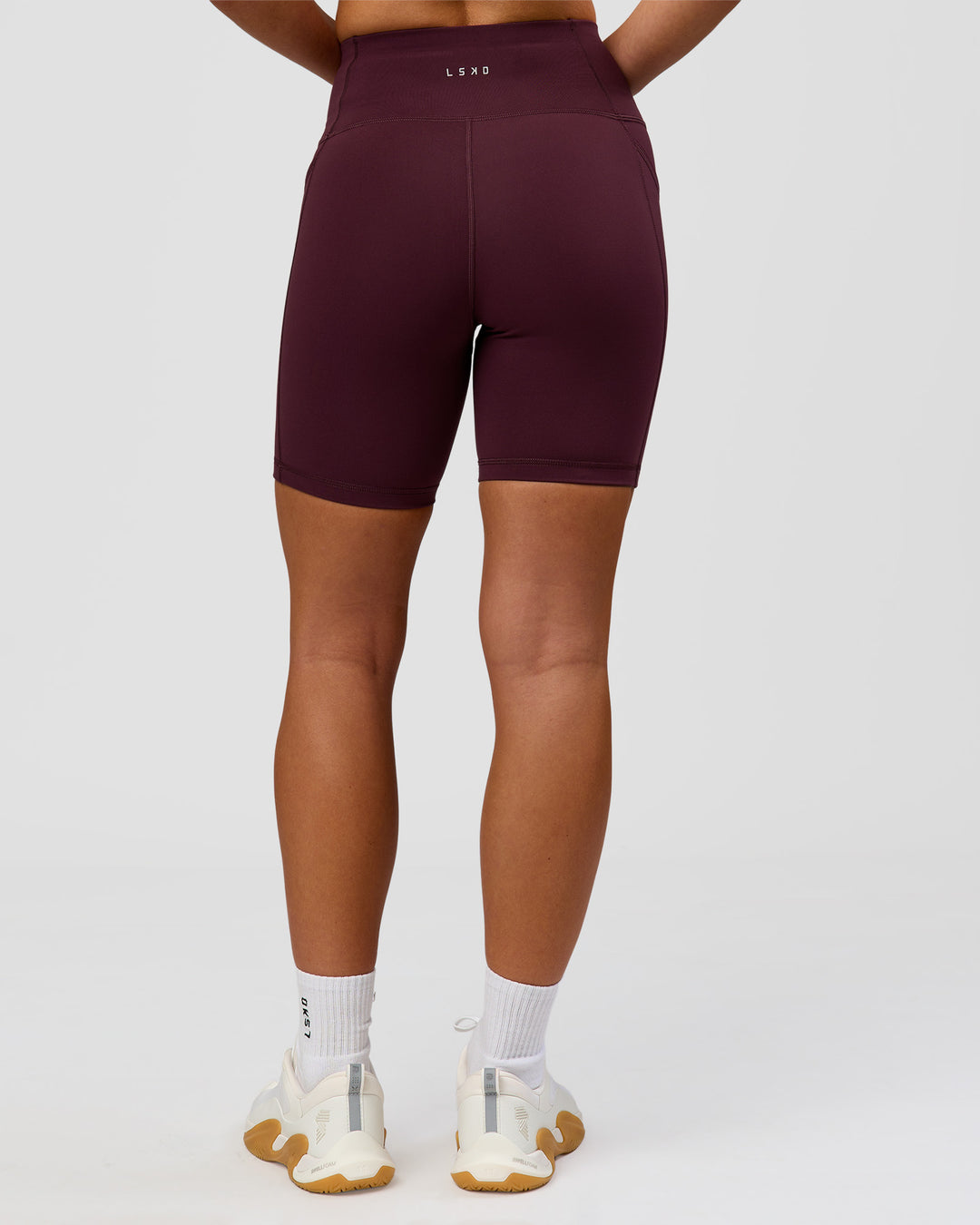 Woman wearing Rep Ultra High-Rise 6" Short Pockets - Cherry Lacquer-White | Model:Issy | Size:XS - view 7