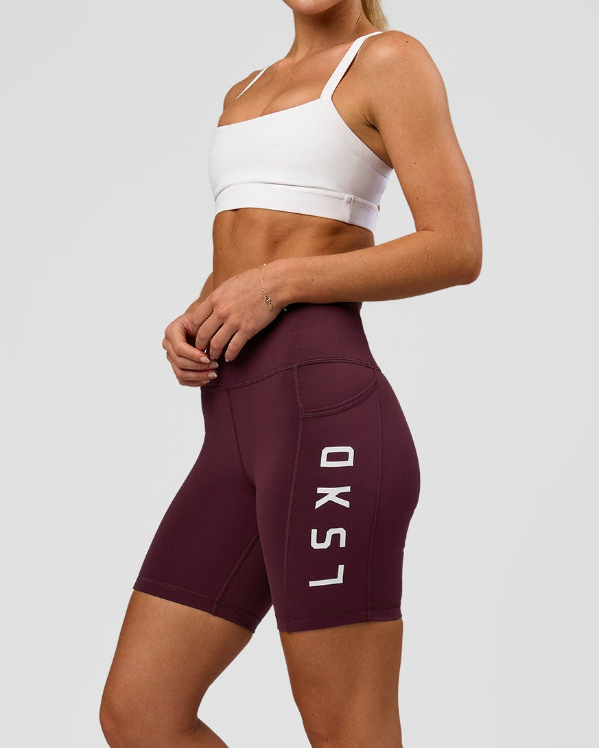 Woman wearing Rep Ultra High-Rise 6" Short Pockets - Cherry Lacquer-White | Model:Issy | Size:XS - view 1