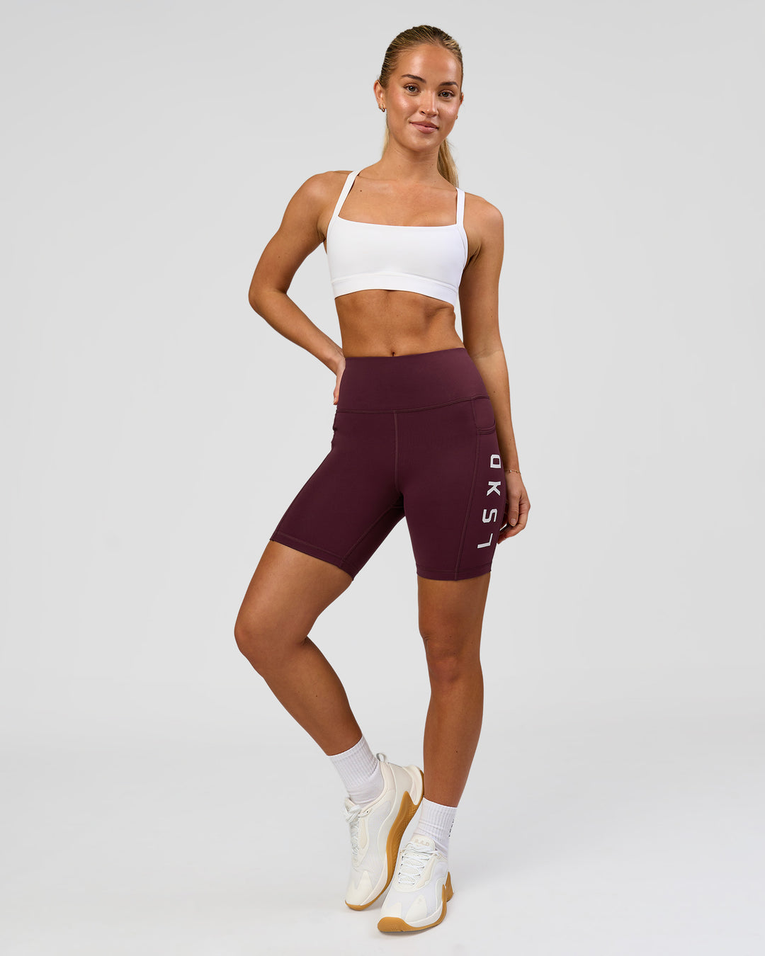 Woman wearing Rep Ultra High-Rise 6" Short Pockets - Cherry Lacquer-White | Model:Issy | Size:XS - view 8