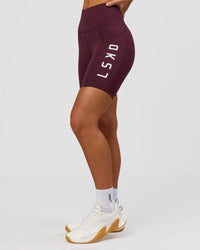 Woman wearing Rep Ultra High-Rise 6" Short Pockets - Cherry Lacquer-White | Model:Issy | Size:XS | Thumbnail Index: 8