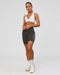 Woman wearing Rep Ultra High-Rise 6" Short Pockets - Onyx-white | Model:Issy | Size:XS | Thumbnail Index: 5