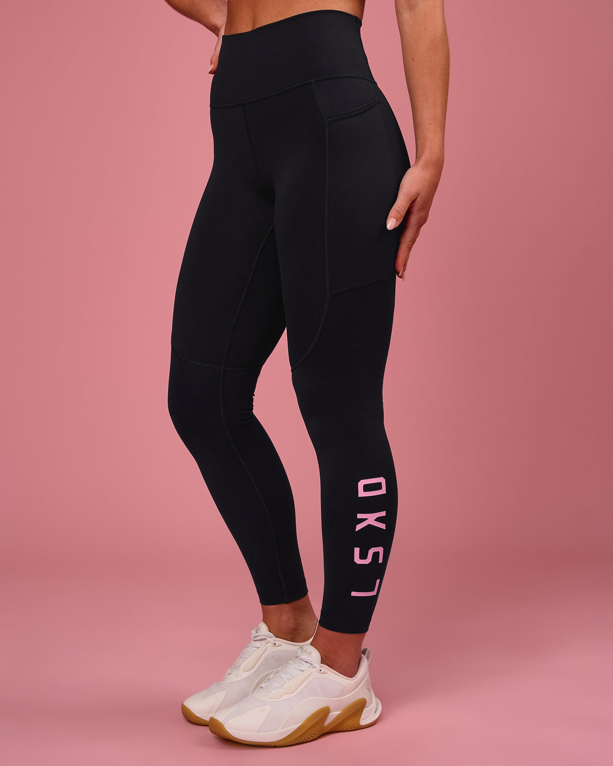 Woman wearing Rep Ultra High-Rise 7/8 Legging Pockets - Black-Pink Rose | Model:Issy | Size:XS