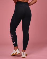 Woman wearing Rep Ultra High-Rise 7/8 Legging Pockets - Black-Pink Rose | Model:Issy | Size:XS | Thumbnail Index: 3