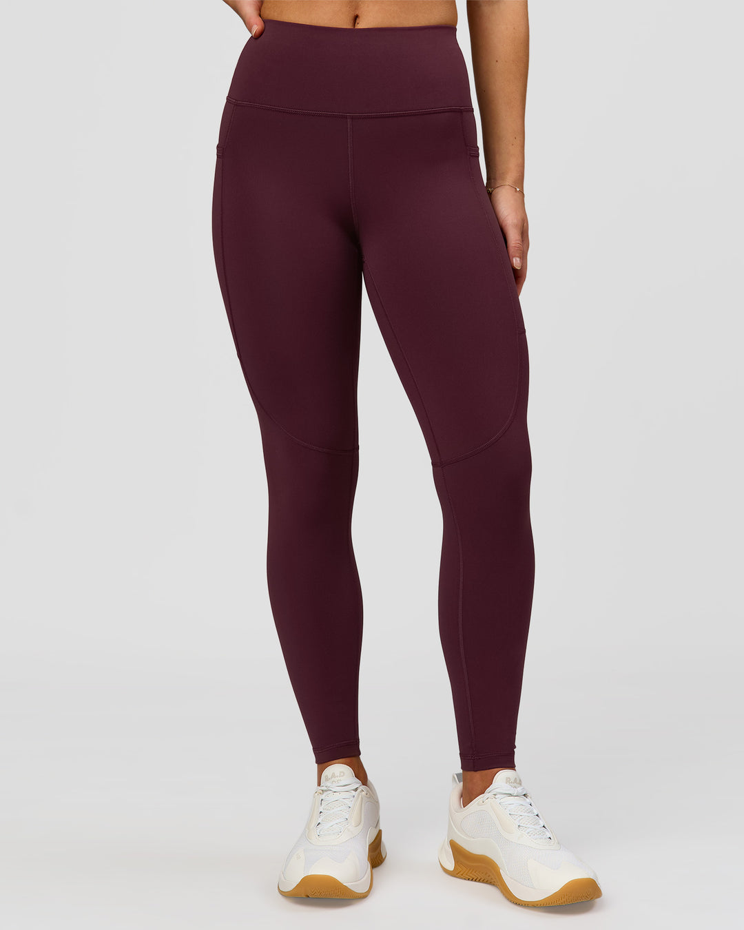 Woman wearing Rep Ultra High-Rise 7/8 Legging Pockets - Cherry Lacquer-White | Model:Issy | Size:XS - view 3