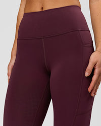 Woman wearing Rep Ultra High-Rise 7/8 Legging Pockets - Cherry Lacquer-White | Model:Issy | Size:XS | Thumbnail Index: 4